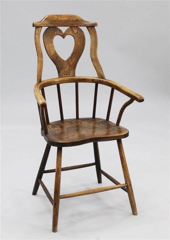 A 19th century elm Windsor type country armchair,